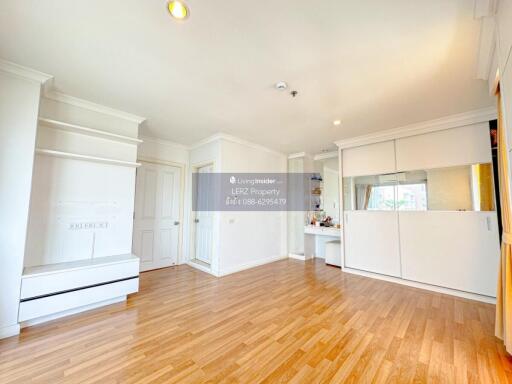 Spacious and bright living room with wooden flooring