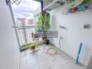 Balcony with plants, outdoor air conditioning unit, water tap, and city view