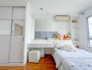 Modern bedroom with white furniture and plush toys