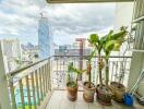 Balcony with potted plants and city view