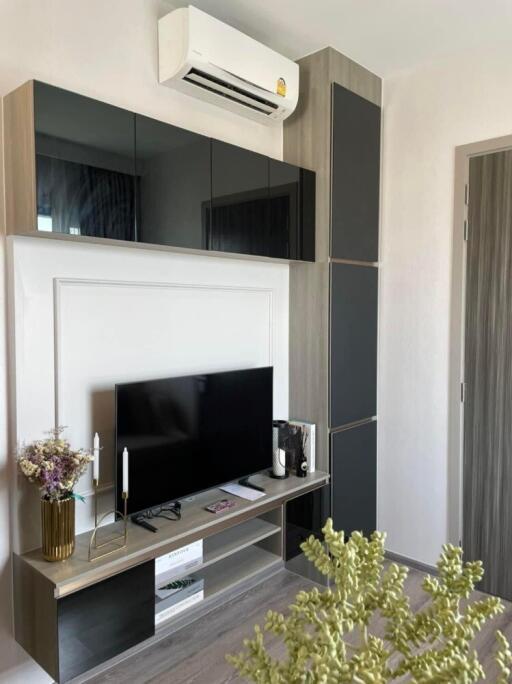 Modern living room with air conditioner and TV stand