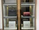 Glass cabinet with luxury items