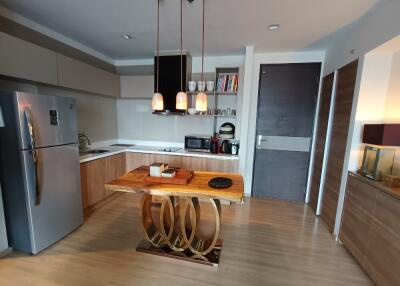 Modern kitchen with stainless steel appliances and wooden cabinets