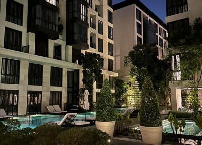 Night view of residential buildings with pool