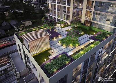 Rooftop garden area of a modern building at night