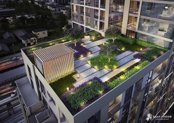 Rooftop garden area of a modern building at night