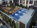 Rooftop swimming pool with lounge chairs and greenery