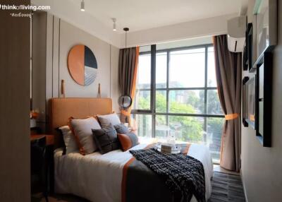 Modern bedroom with large window and stylish decor