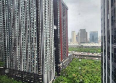 View of high-rise residential buildings with a green area