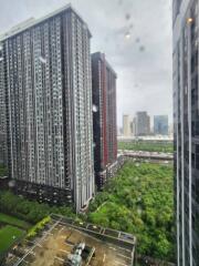 View of high-rise residential buildings with a green area