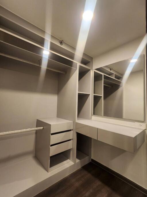 Spacious walk-in closet with built-in shelves