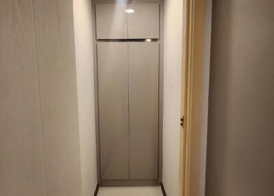 Narrow hallway with closet