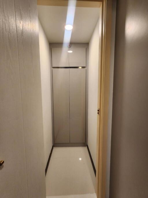 Narrow hallway with closet