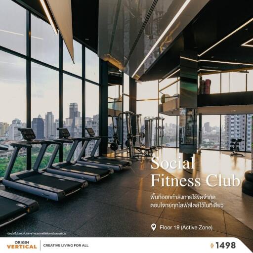 Modern fitness club with city view and exercise equipment