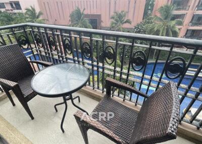 Balcony with seating and pool view