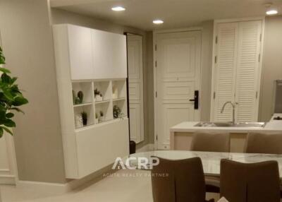 Modern living area with dining table and built-in shelves