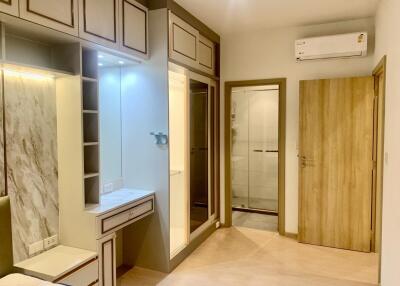 Modern bedroom with built-in vanity and ample storage