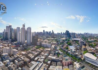 Panoramic view of a city with tall buildings and clear sky