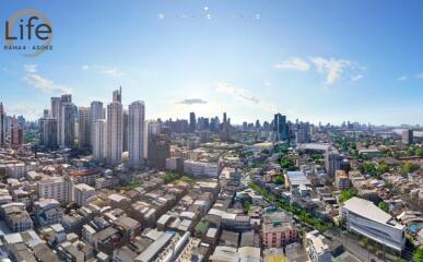 Panoramic view of a city with tall buildings and clear sky