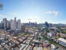 Panoramic view of a city with tall buildings and clear sky