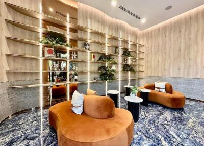 Modern lobby with contemporary seating and decorative shelves