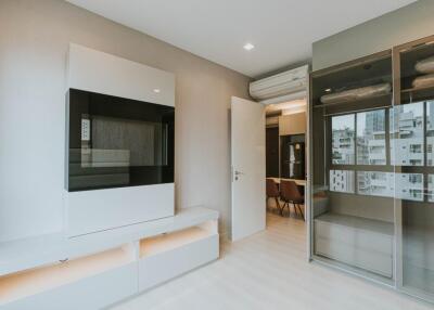 Modern living room with built-in cabinets and city view