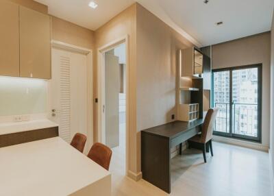 Modern living area with desk and chairs