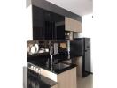 Modern kitchen with black countertops and cabinets