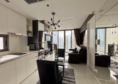 Modern living room with kitchen and city view