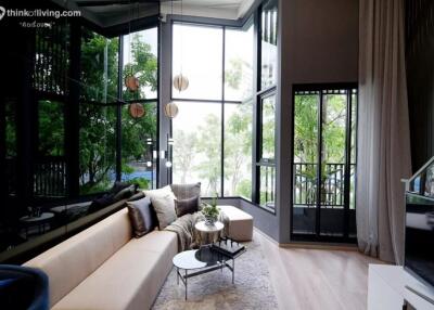 Modern living room with large windows and natural light