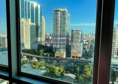 View from the window showcasing cityscape and buildings