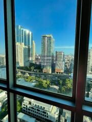 View from the window showcasing cityscape and buildings