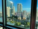 View from the window showcasing cityscape and buildings