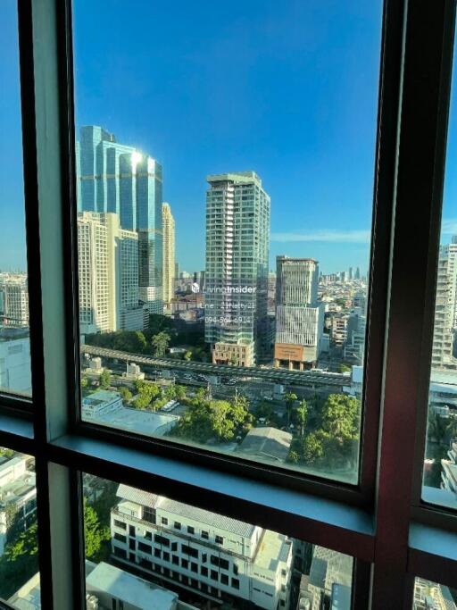 View from the window showcasing cityscape and buildings