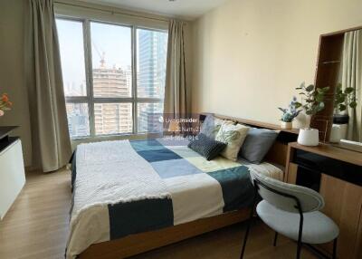 Bedroom with large window and modern furnishings