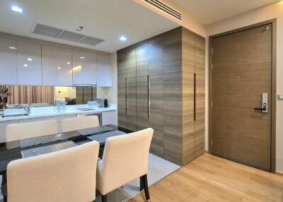 Modern dining area with adjoining kitchen