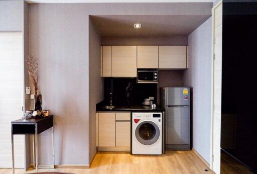 Compact kitchen area with modern appliances