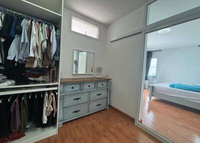 Bedroom with closet and dresser