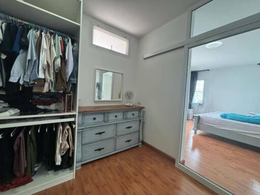 Bedroom with closet and dresser