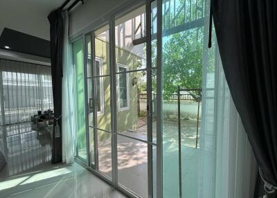 Living room with large sliding glass doors leading to a patio