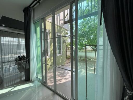 Living room with large sliding glass doors leading to a patio