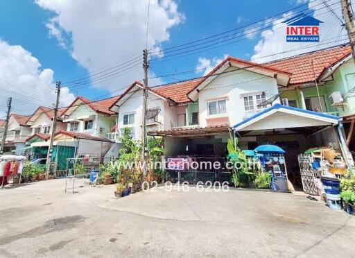 Row of residential houses with front yards