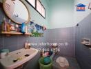 Bathroom with basin, mirror, window, and traditional squat toilet