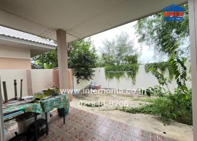 Outdoor area with partially covered patio