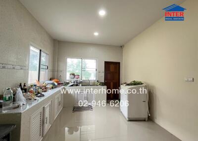 Modern kitchen with large windows and ample counter space