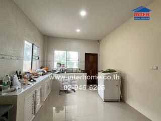 Modern kitchen with large windows and ample counter space