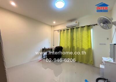 Bedroom with desk, air conditioner, and green curtains