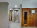 Hallway with wooden door and tiles