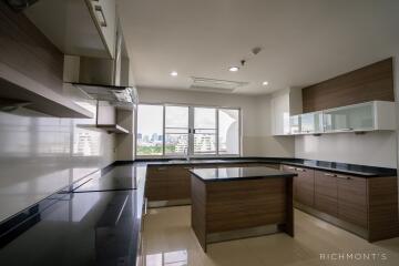 Modern kitchen with island and city view