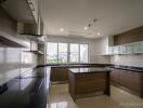 Modern kitchen with island and city view